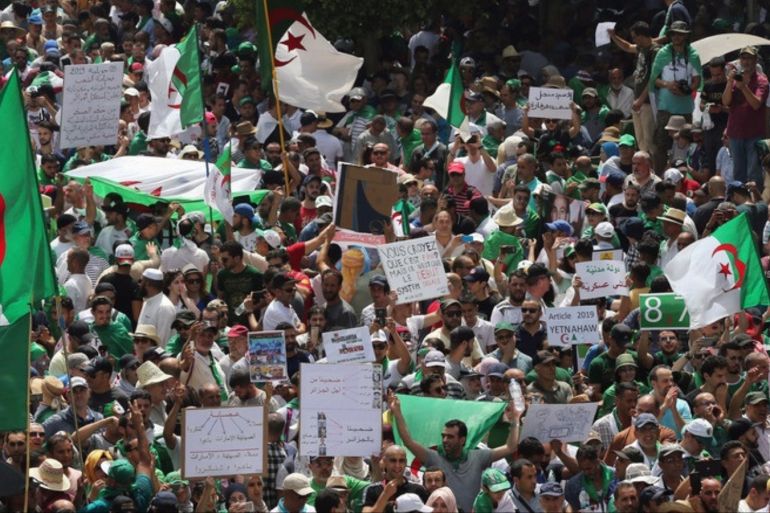 epa07697568 Algerians attend a march calling for the departure of the Algerian regime coinciding with the Algerian Independence Day in Algiers, Algeria, 05 July 2019. Algeria marks its Independence Day to commemorate independence from France on 05 July 1962. Algerians took to the streets to mark the day which falls this year on Friday that had witnessed weekly protests against figures of the former regime since the departure of former president Abdelaziz Bouteflika in A