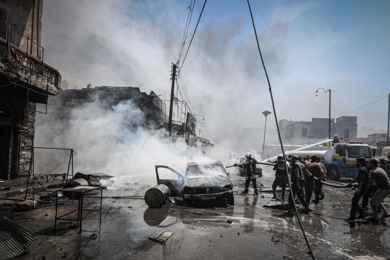 Regime attacks kill 6 in Syria’s de-escalation zone- - IDLIB, SYRIA - JULY 28: Firefighters try to extinguish the fire after Assad Regime warplanes carried out airstrikes on the town of Arihah in Idlib province, Syria on July 28, 2019. At least six civilians were killed and 18 others injured in regime attacks in de-escalation zone in northwestern Syria.
