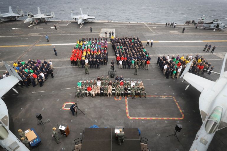 Capt. Putnam H. Browne, commanding officer of the aircraft carrier USS Abraham Lincoln speaks on the flight deck during a change of command ceremony, in the Gulf, in this handout picture released by U.S. Navy on July 29, 2019. Jessica Paulauskas/U.S. Navy/Handout via REUTERS ATTENTION EDITORS- THIS IMAGE HAS BEEN SUPPLIED BY A THIRD PARTY.