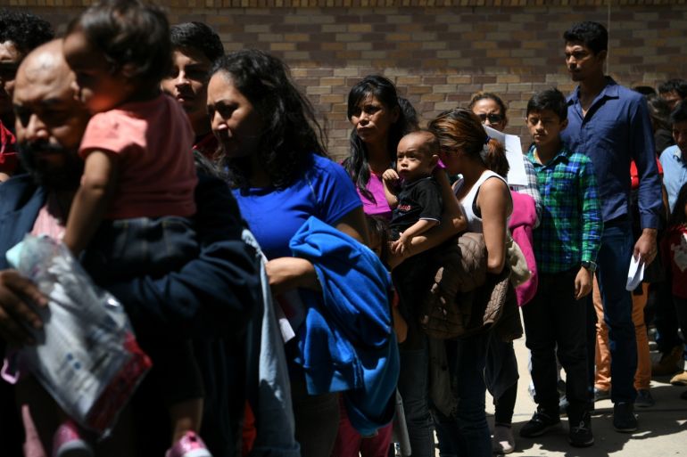 Migrant families seeking asylum are released from federal detention at a bus depot in McAllen, Texas, U.S., July 31, 2019. REUTERS/Loren Elliott