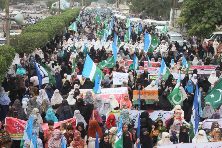 Supporters of Islamic party Jammat-e-Islami (JI) protest against India- - KARACHI, PAKISTAN - AUGUST 08: Pakistani women, supporters of Islamic party Jammat-e-Islami (JI), stage a protest against the Indian government's decision to repeal Article 370 of the Constitution that grants special status to Jammu and Kashmir in Karachi, Pakistan on August 08, 2019.