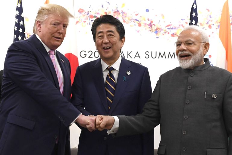 OSAKA, JAPAN - JUNE 28: U.S President Donald Trump does a fist bump with Japan's Prime Minister, Shinzo Abe, and India's Prime Minister, Narendra Modi, during a trilateral meeting on the first day of the G20 summit on June 28, 2019 in Osaka, Japan. U.S. President Donald Trump arrived in Osaka on Thursday for the annual Group of 20 gathering together with other world leaders who will use the two-day summit to discuss pressing economic, climate change, as well as geopol
