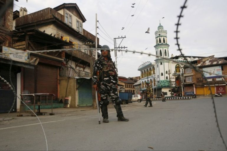epa07770297 Indian paramilitary soldiers stands guard near barbed wire barricade during restriction in Srinagar, India, 12 August 2019. Indian government on 05 August moved a resolution in the parliament that removes the special constitutional status granted to the disputed Kashmir region. The Indian-administered Kashmir region has been under heavy lockdown since then. Kashmir has been a disputed region since 1947 when India and Pakistan won their freedom from British r