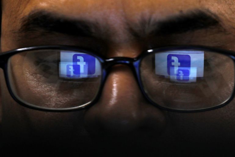 Facebook logo is reflected in glasses in this picture illustration taken April 1, 2019. REUTERS/Akhtar Soomro/Illustration