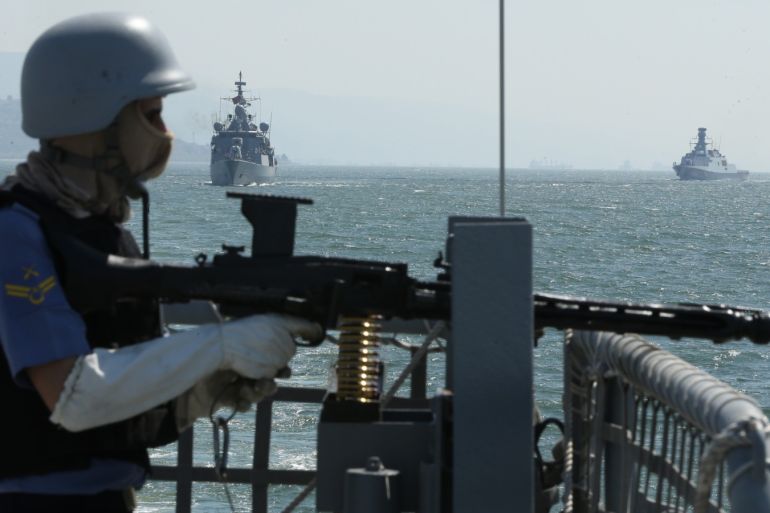 Turkey’s largest military exercise Sea Wolf 2019- - KOCAELI, TURKEY - MAY 13: A Turkish soldier shoots as Turkish Frigates pass under Osmangazi Bridge during the Turkey’s largest military exercise Sea Wolf (Denizkurdu) 2019 in Kocaeli, Turkey on May 13, 2019. The exercise, supervised by the Turkish navy, will run through May 25 in the eastern Mediterranean, Aegean and Black Sea with 131 warships, 57 warplanes and 33 helicopters, the Turkish General Staff said in a statement.