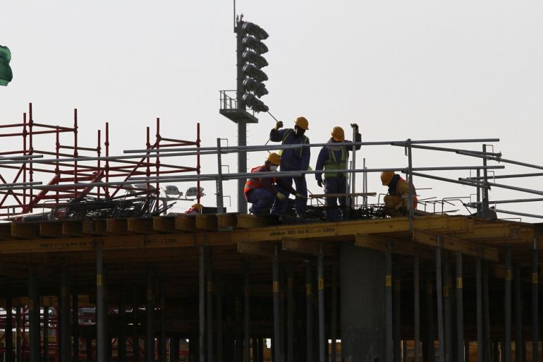 Migrant labourers work at a construction site at the Aspire Zone in Doha, Qatar, March 26, 2016. Workers in Qatar renovating a 2022 World Cup stadium have suffered human rights abuses two years after the tournament's organisers drafted worker welfare standards in the wake of criticism, Amnesty International said. REUTERS/Naseem Zeitoon