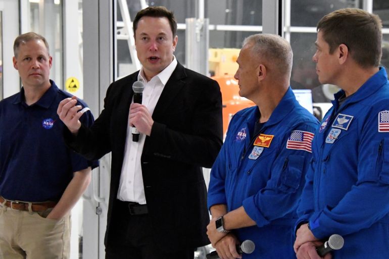 (L-R) NASA Administrator Jim Bridenstine, SpaceX Chief Engineer Elon Musk, NASA astronauts Doug Hurley and Bob Behnken, take questions from the media after a tour of SpaceX headquarters in Hawthorne, California, U.S. October 10, 2019. REUTERS/ Gene Blevins
