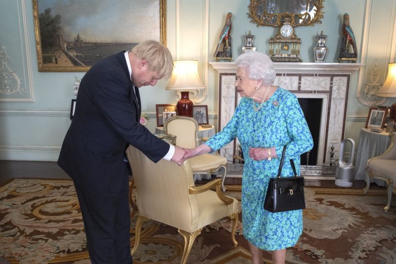 LONDON, ENGLAND - JULY 24: Queen Elizabeth II welcomes newly elected leader of the Conservative party, Boris Johnson during an audience where she invited him to become Prime Minister and form a new government in Buckingham Palace on July 24, 2019 in London, England. The British monarch remains politically neutral and the incoming Prime Minister visits the Palace to satisfy the Queen that they can form her government by being able to command a majority, holding the greater number of seats, in Parliament. Then the Court Circular records that a new Prime Minister has been appointed. (Photo by Victoria Jones - WPA Pool/Getty Images)