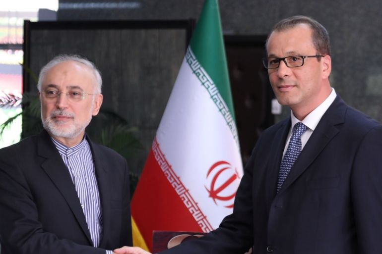 The acting head of the U.N. nuclear watchdog (IAEA), Cornel Feruta, shakes hands with Ali Akbar Salehi, director of Iran's nuclear energy agency in Tehran, Iran September 8, 2019. PR of IAEO (Iran's Atomic Energy Organization)/WANA (West Asia News Agency) via REUTERS ATTENTION EDITORS - THIS IMAGE HAS BEEN SUPPLIED BY A THIRD PARTY.