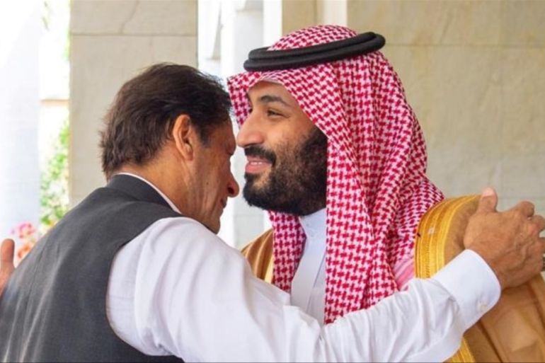 Pakistan's Prime Minister Imran Khan is welcomed by Saudi Arabia's Crown Prince Mohammed bin Salman in Jeddah