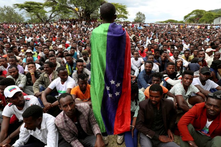 A Sidama youth leader carrying a flag addresses people as they gather for a meeting to declare their own region in Hawassa Ethiopia July 17 2019. REUTERS/Tiksa Negeri TPX IMAGES OF THE DAY