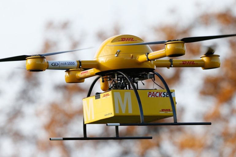 BONN, GERMANY - DECEMBER 09: A quadcopter drone arrives with a small delivery at Deutsche Post headquarters on December 9, 2013 in Bonn, Germany. Deutsche Post is testing deliveries of medicine from a pharmacy in Bonn in an examination into the viability of using drones for deliveries of small packages over short distances. U.S. online retailer Amazon has also started its intention to explore the possibilities of using drones for deliveries. (Photo by Andreas Rentz/Ge
