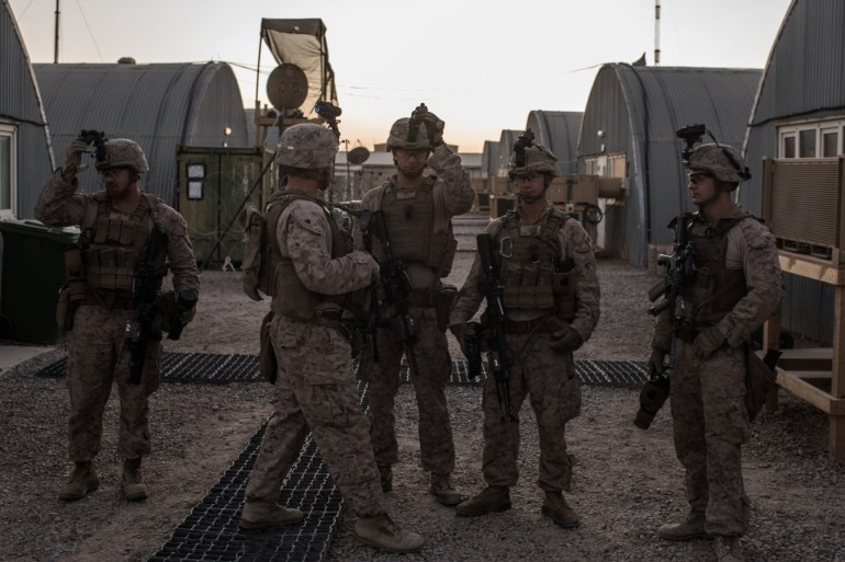 CAMP SHORAB, AFGHANISTAN - SEPTEMBER 11: U.S. marines prepare to man guard stations at Camp Shorab on September 11, 2017 in Helmand Province, Afghanistan. About 300 United States Marines are currently deployed in Helmand Province in a train, advise, and assist role supporting local Afghan security forces. About 300 marines are currently deployed in Helmand Province in a train, advise, and assist role supporting local Afghan security forces. Currently the United States h