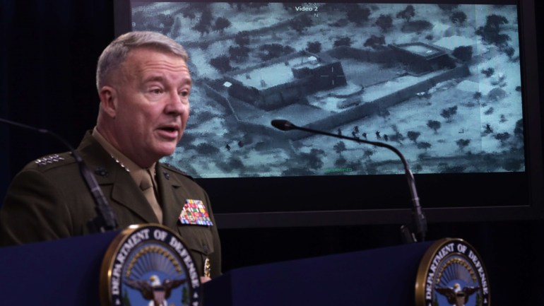 ARLINGTON, VIRGINIA - OCTOBER 30: U.S. Marine Corps Gen. Kenneth McKenzie, commander of U.S. Central Command, speaks as a picture of the operation targeting Abu Bakr al-Baghdadi is seen during a press briefing October 30, 2019 at the Pentagon in Arlington, Virginia. Gen. McKenzie and Hoffman spoke to the media to provide an update on the special operations raid that targeted former ISIS leader Abu Bakr al-Baghdadi in Idlib Province, Syria. Alex Wong/Getty Images/AFP==