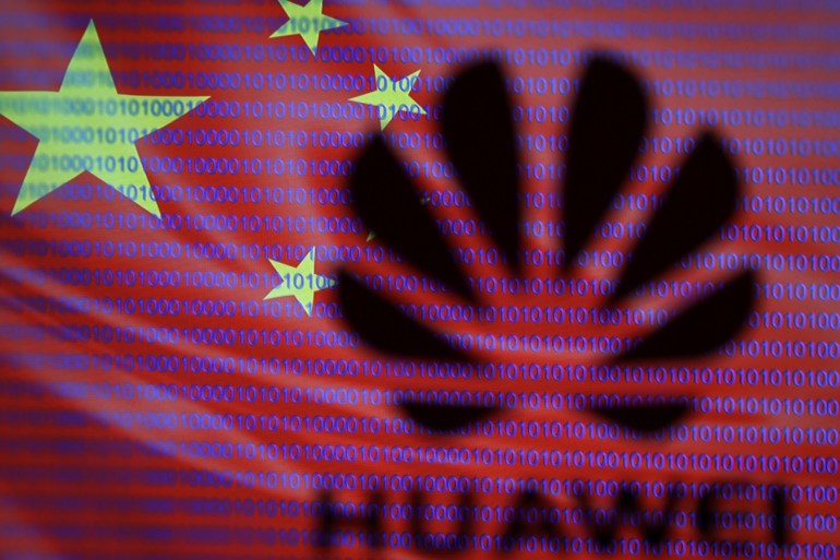 A 3-D printed Huawei logo is seen in front of displayed flag of China and cyber code in this illustration, taken February 12, 2019. REUTERS/Dado Ruvic