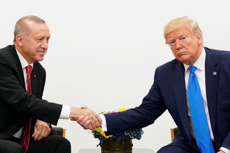 U.S. President Donald Trump shakes hands during a bilateral meeting with Turkey's President Tayyip Erdogan during the G20 leaders summit in Osaka Japan June 29 2019. REUTERS/Kevin Lamarque