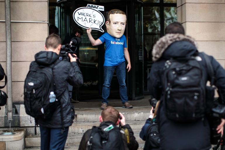 LONDON, ENGLAND - NOVEMBER 27: A protester wearing a model head of Facebook CEO Mark Zuckerberg poses for media outside Portcullis House on November 27, 2018 in London, England. Facebook Vice President Richard Allan appears in front over the Commons culture committee today as part of its fake news inquiry. (Photo by Jack Taylor/Getty Images)