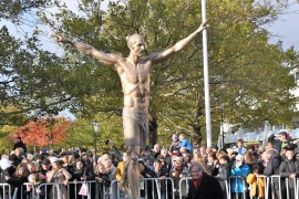 Unveiling of Zlatan Ibrahimovic statue in Malmo- - MALMO, SWEDEN - OCTOBER 8 : Fans take photo of a statue of Swedish soccer star Zlatan Ibrahimovic near Malmo Stadium, in Ibrahimovic's hometown Malmo, Sweden, 08 October 2019. The 2,7 meters bronze statue was created by Swedish sculptor Peter Linde.
