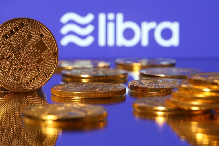 Representations of virtual currency are displayed in front of the Libra logo in this illustration picture, June 21, 2019. REUTERS/Dado Ruvic/Illustration