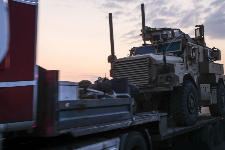 SHEIKHAN, IRAQ - OCTOBER 19: A convoy of U.S. armored military vehicles leave Syria on a road to Iraq on October 19, 2019 in Sheikhan, Iraq. Refugees fleeing the Turkish incursion into Syria arrived in Northern Iraq since the conflict began, with many saying they paid to be smuggled through the Syrian border. (Photo by Byron Smith/Getty Images)