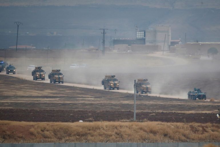 Turkish and Russian military vehicles return following a joint patrol in northeast Syria, as they are pictured from near the Turkish border town of Kiziltepe in Mardin province, Turkey, November 1, 2019. REUTERS/Kemal Aslan