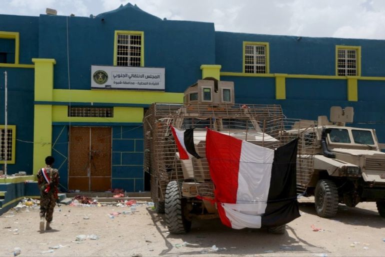 Armored military vehicles used by UAE-backed southern separatist fighters are seen outside the headquarters of the separatist Southern Transitional Council, taken by government forces during the recent clashes, in Ataq, Yemen August 27, 2019. REUTERS/Ali Owidha