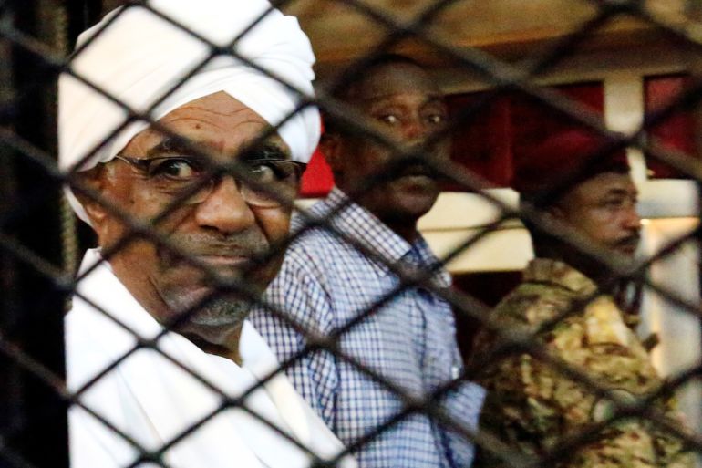 Sudan's former president Omar Hassan al-Bashir sits inside a cage at the courthouse where he is facing corruption charges, in Khartoum, Sudan August 31, 2019. REUTERS/Mohamed Nureldin Abdallah