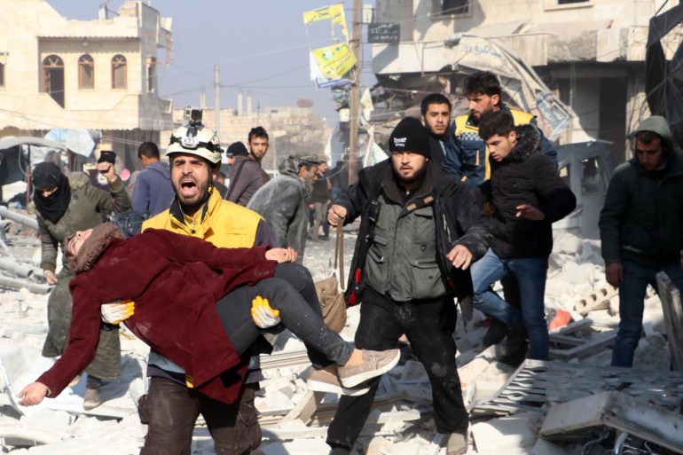 Airstrikes in Syria's Idlib - - IDLIB, SYRIA - DECEMBER 21: Injured Syrians are being moved away from the site after airstrikes carried out by Assad Regime over Saraqib district in the de-escalation zone of Idlib, Syria on December 21, 2019. Airstrikes killed 8 civilians and injured 20 others.