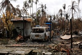 A car is seen near a house that was burnt down during the last days violence in Maungdaw, Myanmar August 31, 2017. RETUERS/Soe Zeya Tun