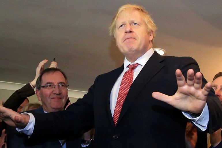 Britain's Prime Minister Boris Johnson gestures as he speaks to supporters on a visit to meet newly elected Conservative party MP for Sedgefield, Paul Howell, at Sedgefield Cricket Club in County Durham, north east England on December 14, 2019, following his Conservative party's general election victory. Lindsey Parnaby/Pool via REUTERS