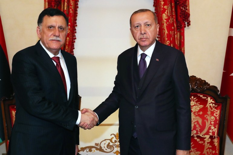 Erdogan - Sarraj meeting in Istanbul- - ISTANBUL, TURKEY - DECEMBER 15: (----EDITORIAL USE ONLY – MANDATORY CREDIT - "TURKISH PRESIDENCY / MURAT CETINMUHURDAR / HANDOUT" - NO MARKETING NO ADVERTISING CAMPAIGNS - DISTRIBUTED AS A SERVICE TO CLIENTS----) Turkish President Recep Tayyip Erdogan (R) meets Chairman of the Presidential Council of Libya’s Government of National Accord (GNA), Fayez al-Sarraj (L) in Istanbul, Turkey on December 15, 2019.
