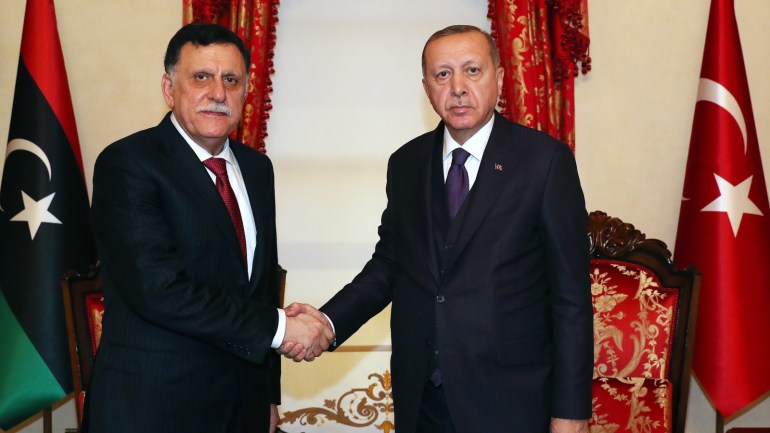 Erdogan - Sarraj meeting in Istanbul- - ISTANBUL, TURKEY - DECEMBER 15: (----EDITORIAL USE ONLY – MANDATORY CREDIT - "TURKISH PRESIDENCY / MURAT CETINMUHURDAR / HANDOUT" - NO MARKETING NO ADVERTISING CAMPAIGNS - DISTRIBUTED AS A SERVICE TO CLIENTS----) Turkish President Recep Tayyip Erdogan (R) meets Chairman of the Presidential Council of Libya’s Government of National Accord (GNA), Fayez al-Sarraj (L) in Istanbul, Turkey on December 15, 2019.