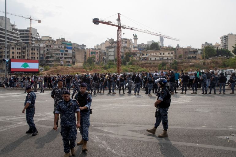 Riot police stand guard following a police operation to open a highway blocked by demonstrators during ongoing anti-government protests in downtown Beirut, Lebanon, October 26, 2019. REUTERS/Alkis Konstantinidis