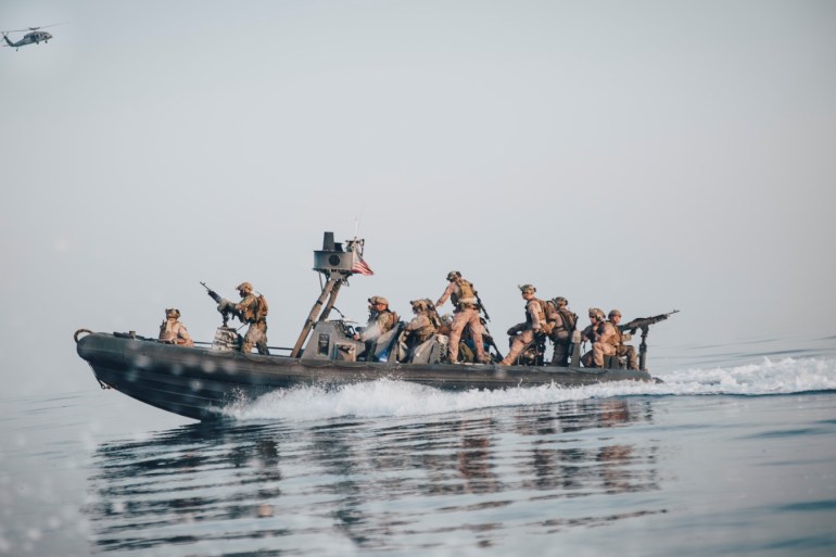 Marines with the Maritime Raid Force, 11th Marine Expeditionary Unit (MEU) ride in a rigid-hull inflatable boat during a visit, board, search and seizure exercise in the Gulf, in this undated handout picture released by U.S. Navy on July 25, 2019. Matthew Teutsch/U.S. Navy/Handout via REUTERS ATTENTION EDITORS- THIS IMAGE HAS BEEN SUPPLIED BY A THIRD PARTY