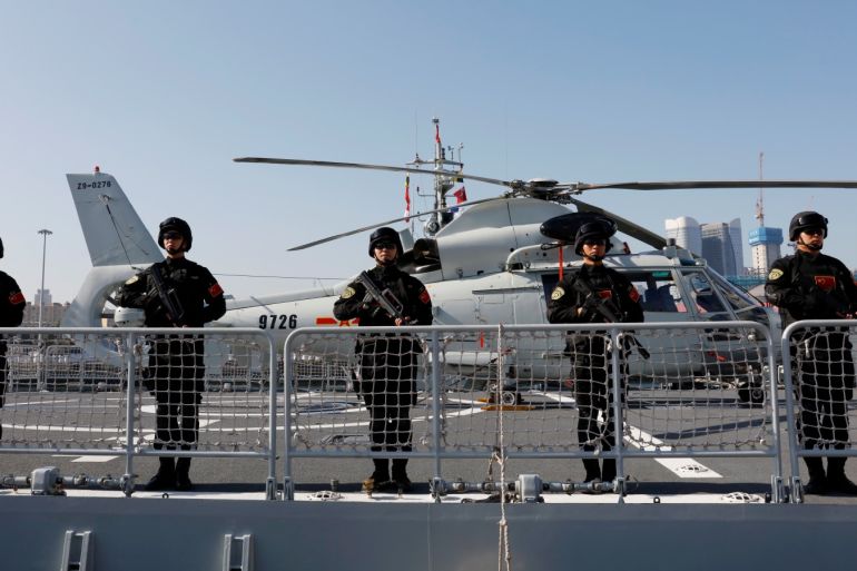 Chinese People's Liberation Army (PLA) Navy soldiers stand guard on the guided missile destroyer Xining as they depart for the escort mission in the Gulf of Aden and off the Somali coast, at a port in Qingdao, Shandong province, China August 29, 2019. REUTERS/Stringer ATTENTION EDITORS - THIS IMAGE WAS PROVIDED BY A THIRD PARTY. CHINA OUT.