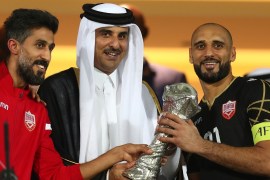 Soccer Football - Gulf Cup - Final - Bahrain v Saudi Arabia - Abdullah bin Khalifa Stadium, Doha, Qatar - December 8, 2019 Emir Sheikh Tamim bin Hamad al-Thani shakes hands with Bahrain's Sayed Mohammed Jaafar after the match REUTERS/Ibraheem Al Omari
