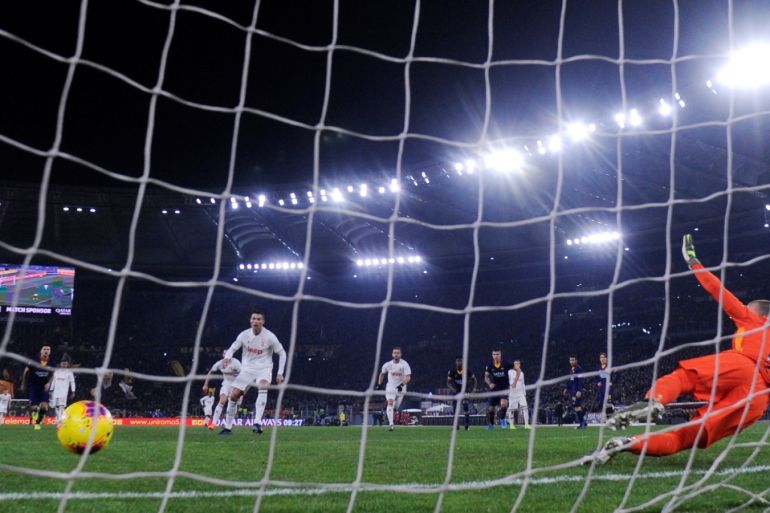 Soccer Football - Serie A - AS Roma v Juventus - Stadio Olimpico, Rome, Italy - January 12, 2020 Juventus' Cristiano Ronaldo scores their second goal from the penalty spot REUTERS/Alberto Lingria