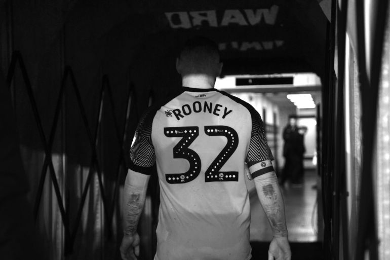 DERBY, ENGLAND - JANUARY 02: (EDITORS NOTE: Image has been converted to black and white.) Wayne Rooney of Derby County walks down the tunnel after making his debut during the Sky Bet Championship match between Derby County and Barnsley at Pride Park Stadium on January 02, 2020 in Derby, England. (Photo by Laurence Griffiths/Getty Images)