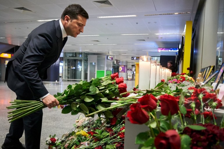 Ukrainian President Volodymyr Zelenskiy lays flowers to commemorate victims of the Ukraine International Airlines Boeing 737-800 plane crash, at a memorial in Boryspil International airport outside Kiev, Ukraine January 9, 2020. Ukrainian Presidential Press Service/Handout via REUTERS ATTENTION EDITORS - THIS IMAGE WAS PROVIDED BY A THIRD PARTY.
