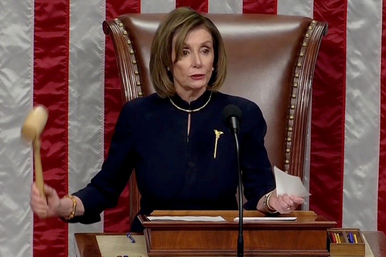 U.S. Speaker of the House Nancy Pelosi (D-CA) wields the gavel as the House of Representatives votes on the second of two articles of impeachment against U.S. President Donald Trump, accusing the president of abusing his power and obstructing Congress, inside the House Chamber of the U.S. Capitol in Washington, U.S., in a still image from video December 18, 2019. House TV via REUTERS
