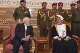 Oman's Sultan Haitham receives Iranian Foreign Minister Javad Zarif after his arrival to attend an official mourning ceremony for the late Sultan Qaboos, in Muscat, Oman on January 12 [AP]