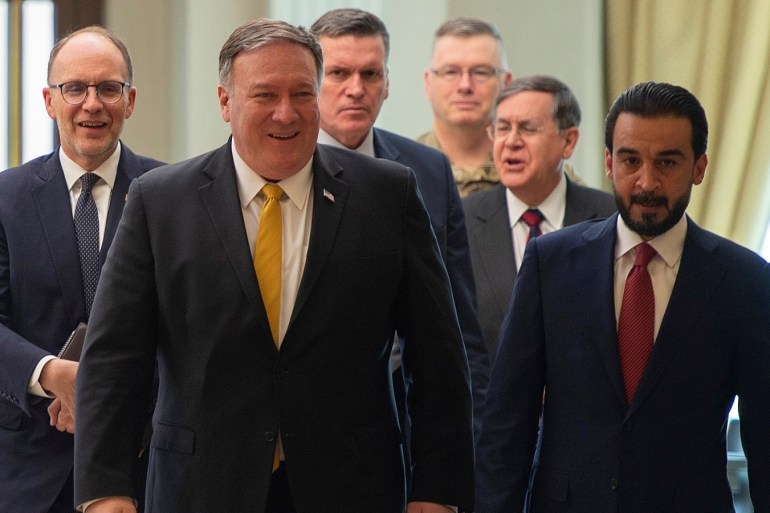 U.S. Secretary of State Mike Pompeo walks alongside Iraq's Parliament Speaker Mohammed al-Halbusi in Baghdad, during a Middle East tour, Iraq, January 9, 2019. Andrew Caballero-Reynolds/Pool via REUTERS
