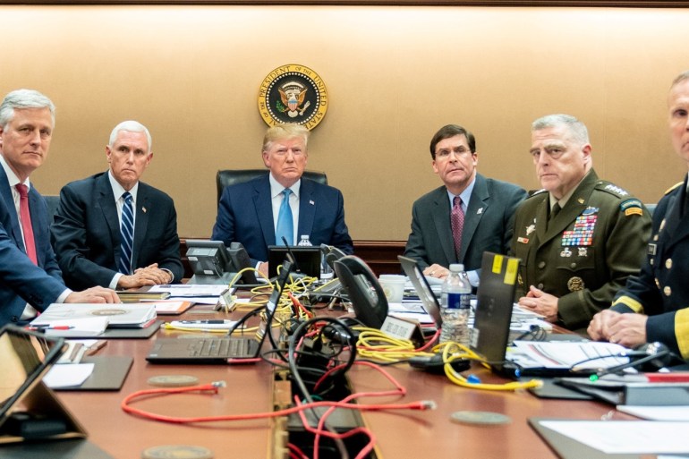 U.S. President Donald Trump, U.S. Vice President Mike Pence (2nd L), U.S. Secretary of Defense Mark Esper (3rd R), along with members of the national security team, watch as U.S. Special Operations forces close in on ISIS leader Abu Bakr al-Baghdadi, in the Situation Room of the White House in Washington, U.S., October 26, 2019. Picture taken October 26, 2019. Shealah Craighead/The White House/Handout via REUTERS THIS IMAGE HAS BEEN SUPPLIED BY A THIRD PARTY. TPX IMAGES OF THE DAY