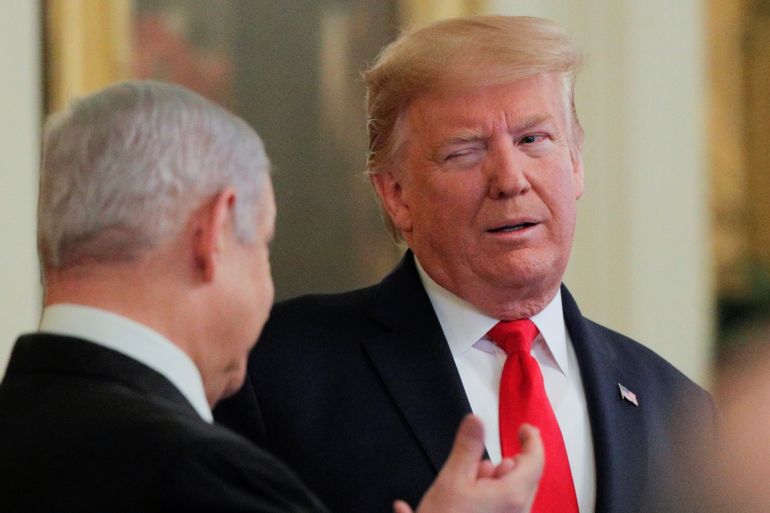 U.S. President Donald Trump winks at Israel's Prime Minister Benjamin Netanyahu as they discuss a Middle East peace plan proposal during a joint news conference in the East Room of the White House in Washington, U.S., January 28, 2020. REUTERS/Brendan McDermid