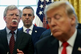 FILE PHOTO: U.S. President Donald Trump listens as his national security adviser John Bolton speaks during a presidential memorandum signing for the "Women's Global Development and Prosperity" initiative in the Oval Office at the White House in Washington, U.S., February 7, 2019. REUTERS/Leah Millis/File Photo