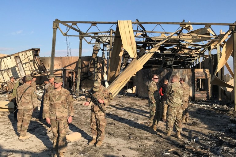 U.S. soldiers inspect the site where an Iranian missile hit at Ain al-Asad air base in Anbar province, Iraq January 13, 2020. REUTERS/John Davison