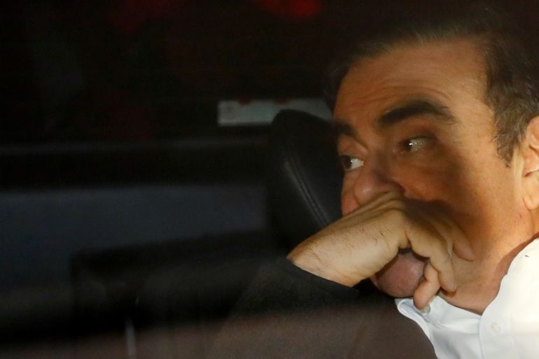 Former Nissan Motor Chairman Carlos Ghosn sits inside a car as he leaves his lawyer's office after being released on bail from Tokyo Detention House, in Tokyo, Japan, March 6, 2019. REUTERS/Issei Kato