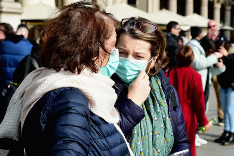 Coronavirus precautions in Italy- - MILAN, ITALY - FEBRUARY 23: Women wearing respiratory masks are seen on February 23, 2020 in Milan, Italy. The Lombardy is one of the most affected region in Italy by the infection of the Coronavirus COVID-19 virus.