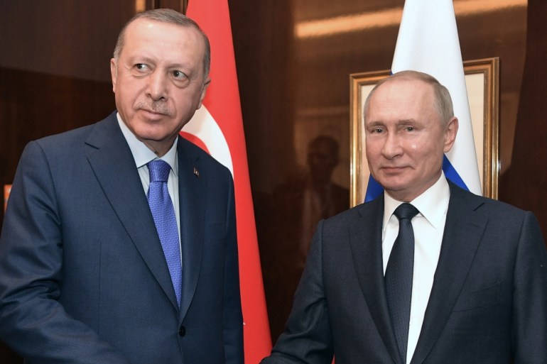 Russian President Vladimir Putin and his Turkish counterpart Tayyip Erdogan shakes hands during their meeting on sideline of the Libya summit in Berlin, Germany January 19, 2020. Sputnik/Aleksey Nikolskyi/Kremlin via REUTERS ATTENTION EDITORS - THIS IMAGE WAS PROVIDED BY A THIRD PARTY.