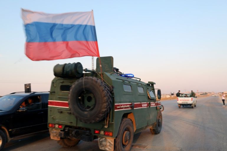 epa07953363 Russian military police forces patrol an area at Qamishli, northern Syria, 26 October 2019 (issued on 27 October 2019). Media reports state Russian military police began patrols on part of the Syrian borders with Turkey as part of an accord with Turkey over control of northeastern Syria. EPA-EFE/AHMED MARDNLI